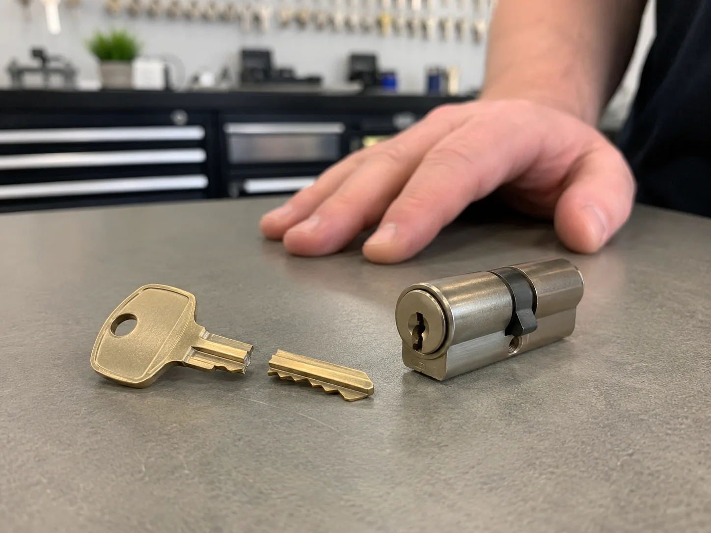 Locksmith removing a broken key from a door lock